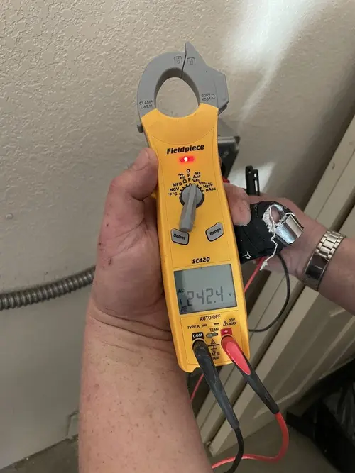 Voltage testing with clamp meter during Hot Tub / Pool Electrical Wiring in Dingman